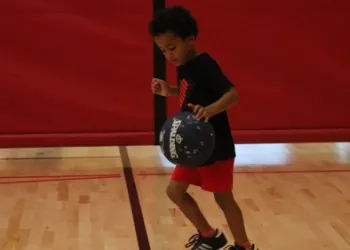 Little boy dribbling a basketball